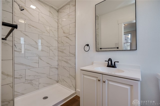 bathroom featuring vanity and a tile shower