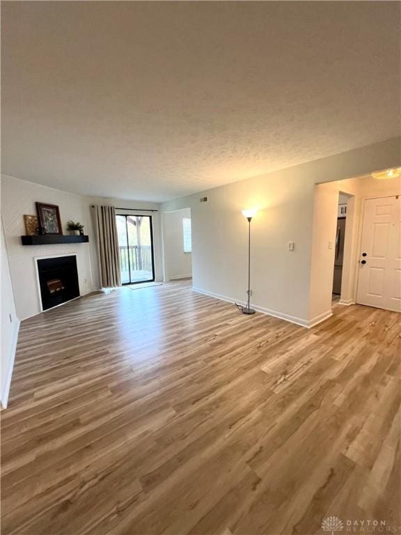 unfurnished living room with hardwood / wood-style flooring