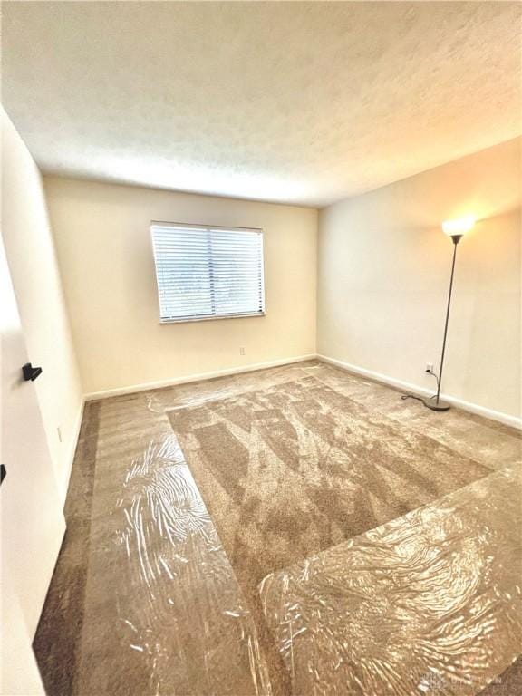 unfurnished room with carpet floors