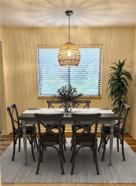 dining area with hardwood / wood-style floors