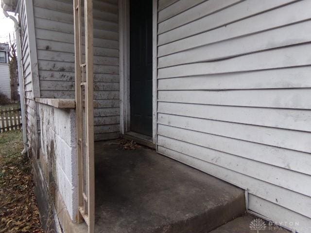 view of exterior entry with fence