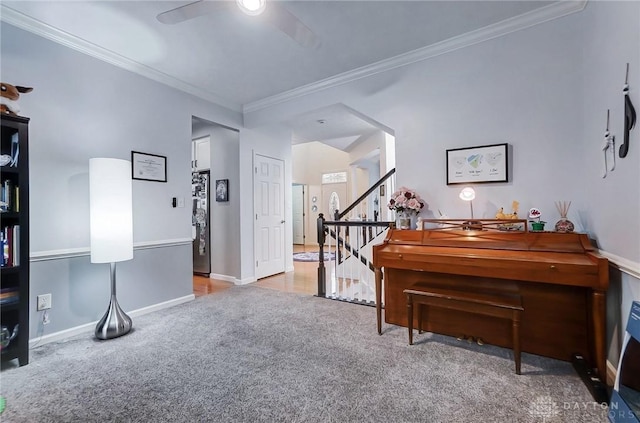 misc room featuring ceiling fan, ornamental molding, and light carpet