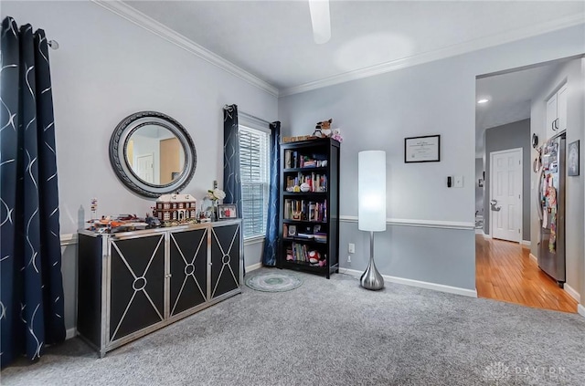 misc room with carpet and ornamental molding