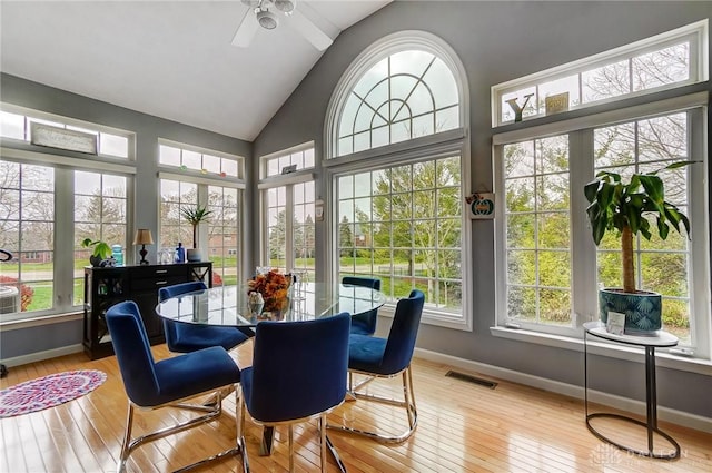 sunroom / solarium with ceiling fan and lofted ceiling