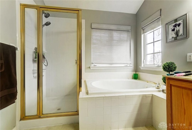 bathroom featuring independent shower and bath and vaulted ceiling