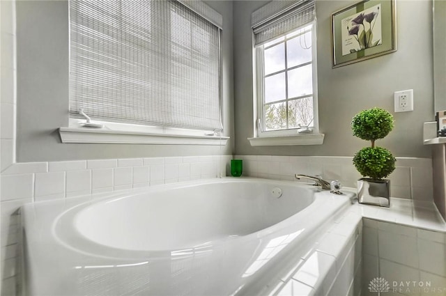 bathroom with tiled tub