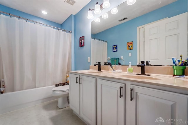 full bathroom with shower / tub combo with curtain, vanity, concrete floors, and toilet