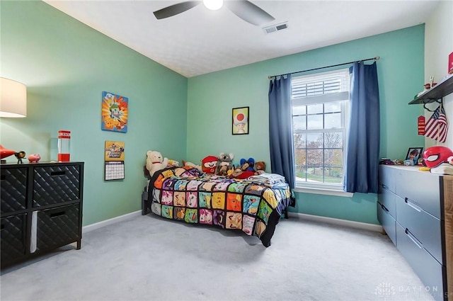 bedroom with ceiling fan and light colored carpet