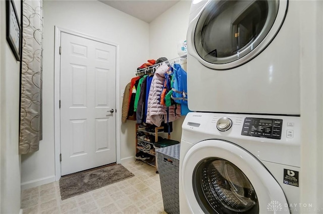 laundry area with stacked washing maching and dryer