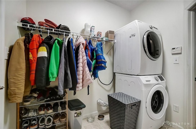 washroom with stacked washer and clothes dryer