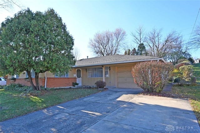 single story home featuring a garage, concrete driveway, and brick siding