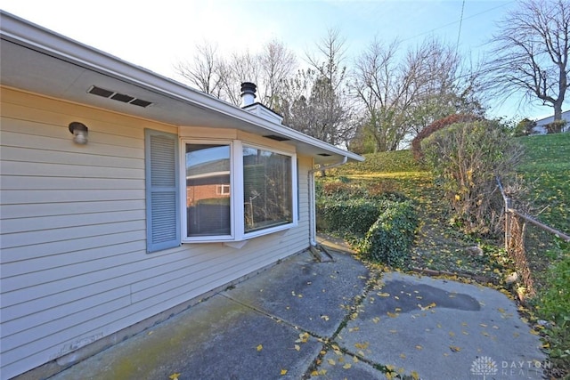 view of side of home featuring a patio