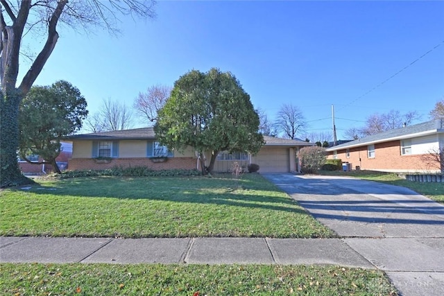 ranch-style house with a front yard, concrete driveway, brick siding, and an attached garage