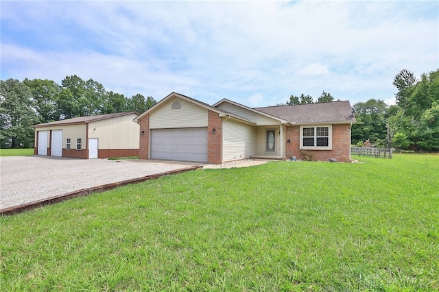 ranch-style home featuring a front lawn and a garage