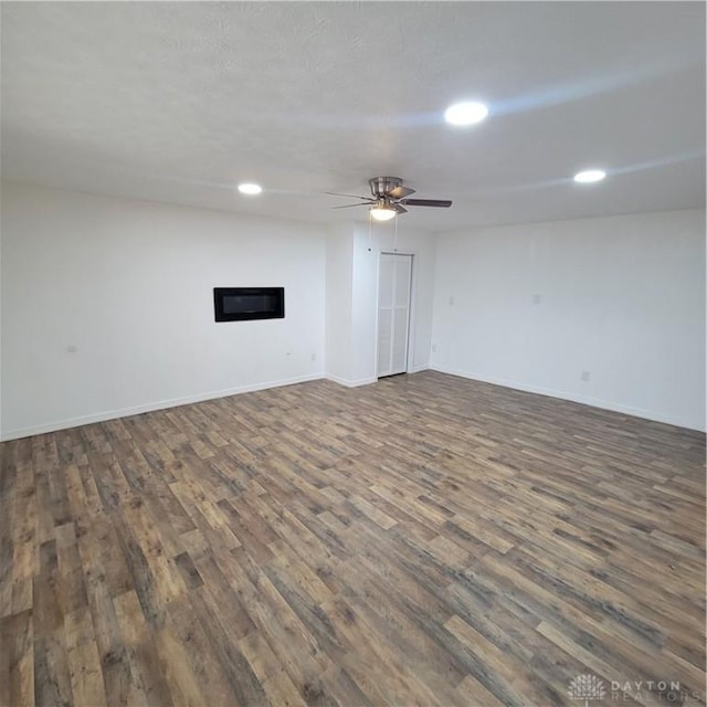 unfurnished living room featuring dark hardwood / wood-style flooring