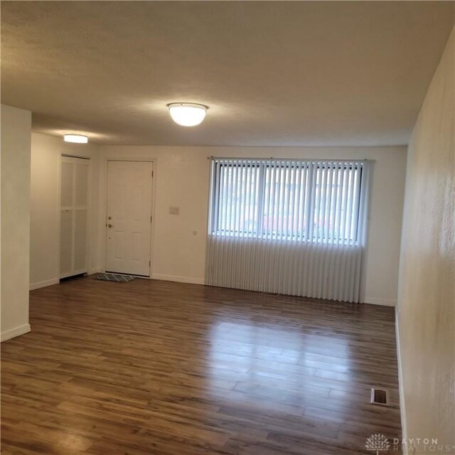 1246 Angiers Dr, Dayton, OH 45417 - unfurnished room with dark wood-style floors and baseboards