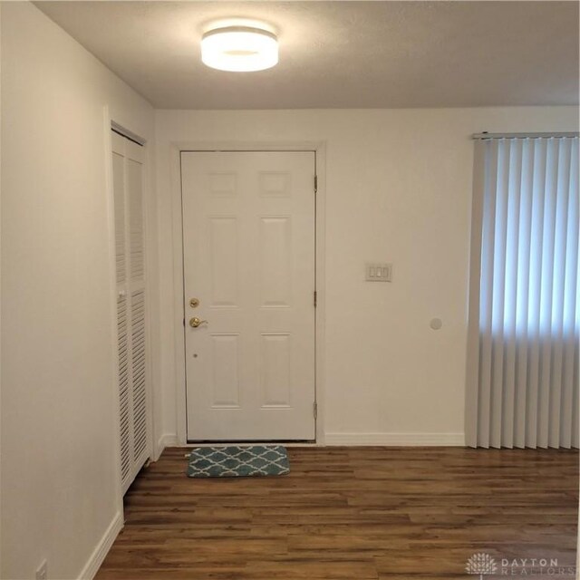 1246 Angiers Dr, Dayton, OH 45417 - foyer entrance featuring dark wood-type flooring and baseboards