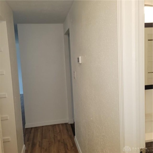 1246 Angiers Dr, Dayton, OH 45417 - corridor with dark wood finished floors and baseboards