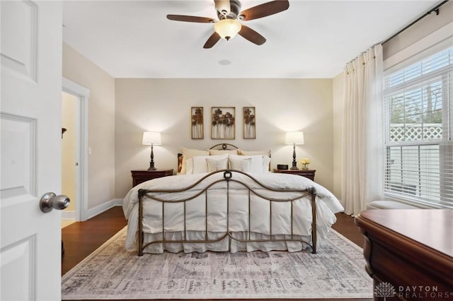 bedroom featuring hardwood / wood-style flooring and ceiling fan