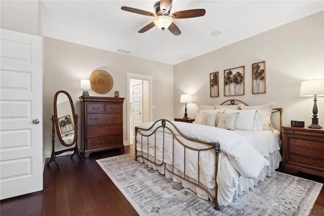 bedroom featuring ceiling fan and dark hardwood / wood-style flooring