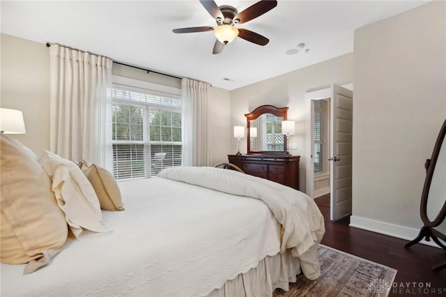 bedroom featuring dark hardwood / wood-style floors and ceiling fan