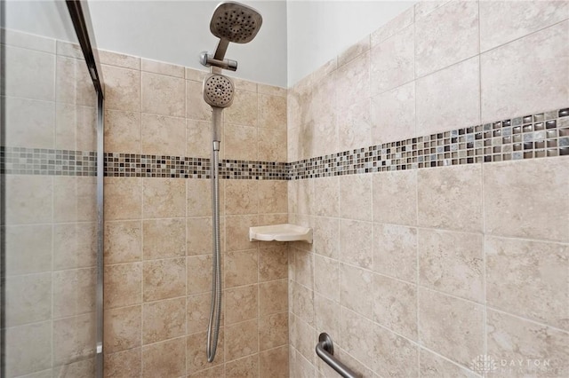 bathroom with tiled shower