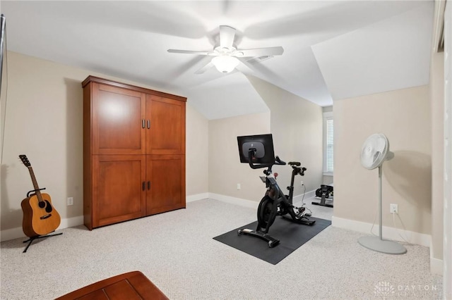 exercise room with ceiling fan, lofted ceiling, and light carpet