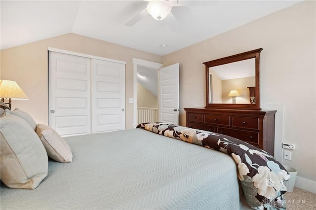 bedroom featuring ceiling fan, vaulted ceiling, carpet floors, and a closet