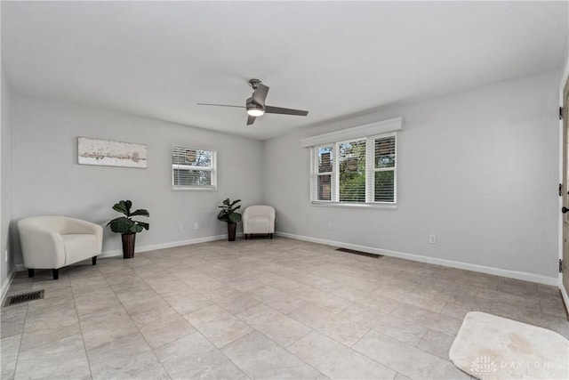 unfurnished room with ceiling fan