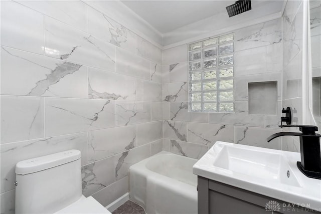 full bathroom with crown molding, vanity, tile walls, and toilet