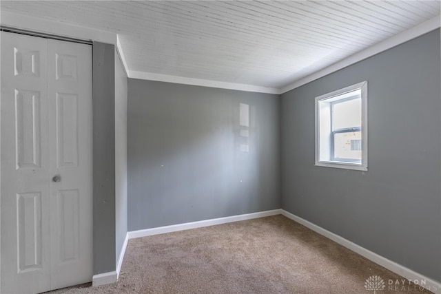 unfurnished bedroom with carpet and a closet