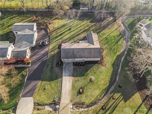 birds eye view of property with a rural view