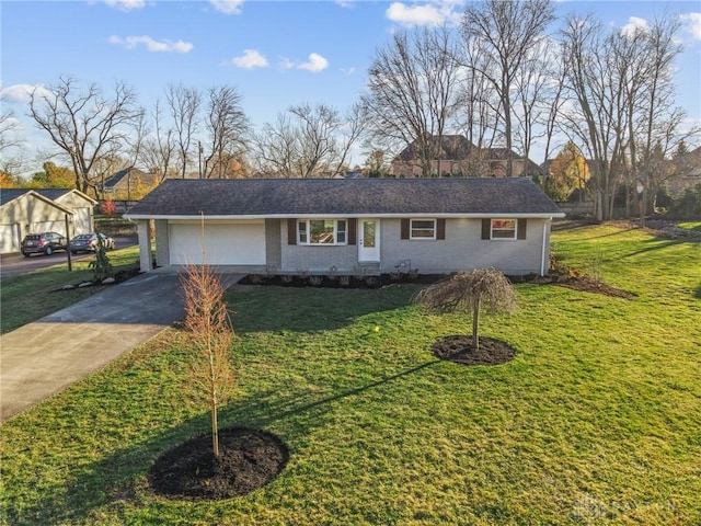 ranch-style home with a garage and a front yard