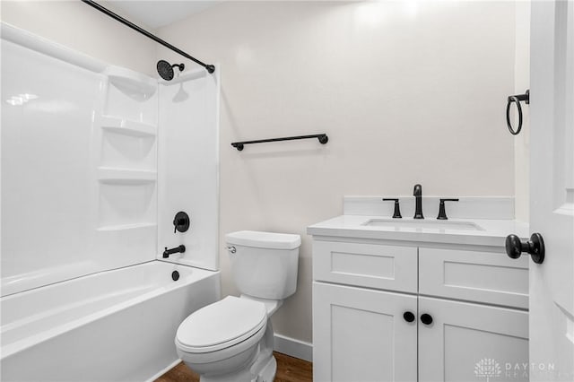 full bathroom featuring vanity, toilet, wood-type flooring, and bathing tub / shower combination