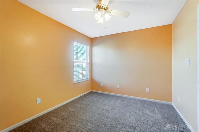 empty room featuring carpet and ceiling fan