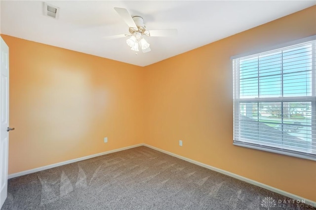 unfurnished room featuring carpet and ceiling fan