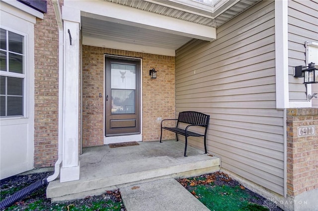 property entrance with covered porch