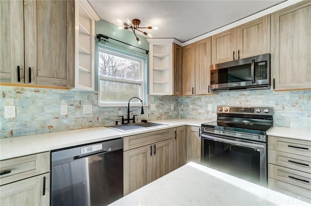 kitchen with backsplash, sink, stainless steel appliances, and light brown cabinets