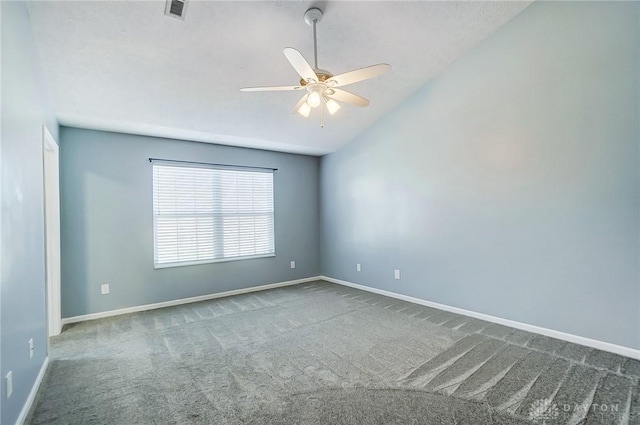 unfurnished room with carpet, vaulted ceiling, and ceiling fan