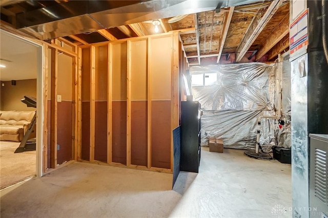 basement featuring heating unit