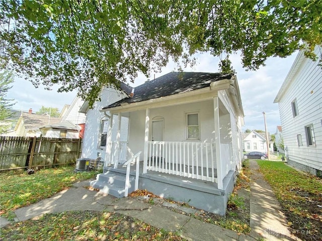 bungalow-style house featuring central AC and a porch