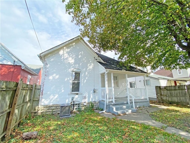 rear view of property with central air condition unit