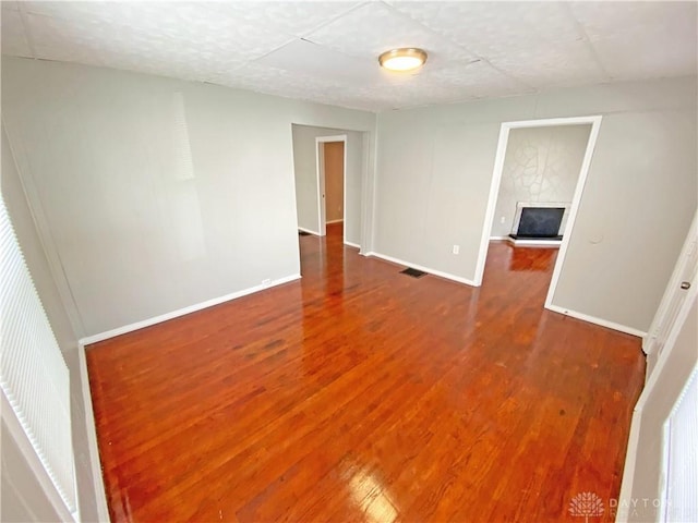 unfurnished room featuring hardwood / wood-style floors