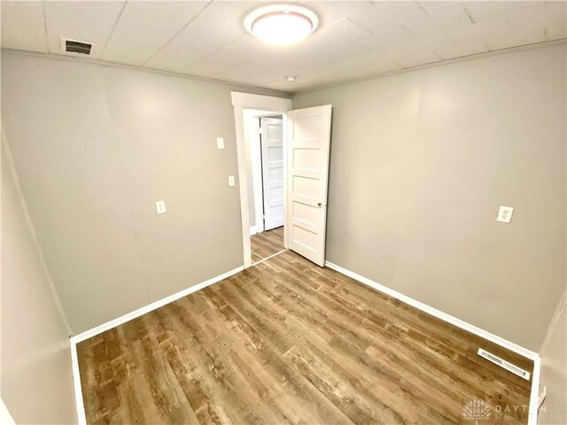 unfurnished bedroom featuring hardwood / wood-style flooring