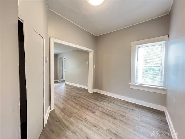 unfurnished room with hardwood / wood-style floors