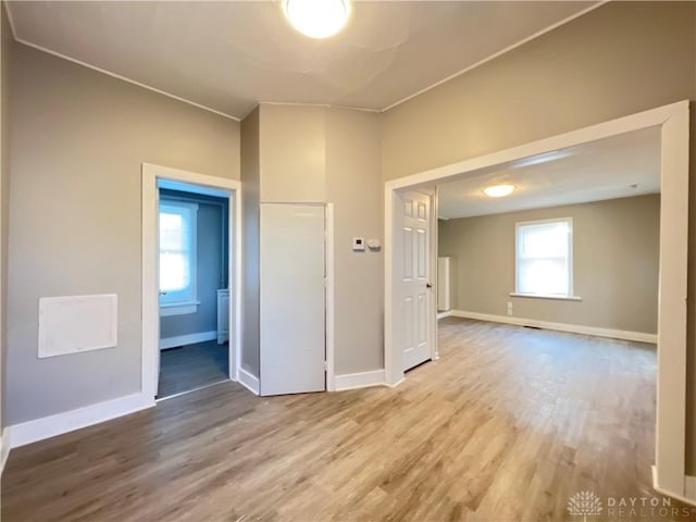 spare room featuring wood-type flooring