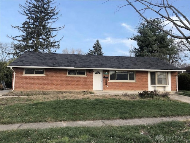 ranch-style house with a front lawn