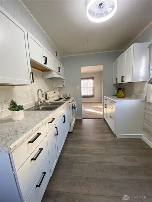 kitchen featuring white cabinetry, sink, white electric range oven, and dark hardwood / wood-style floors