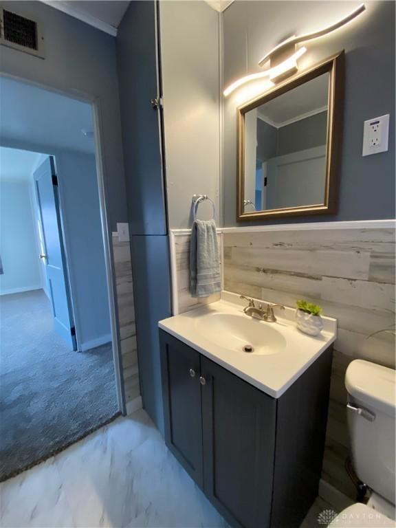 bathroom with vanity and toilet