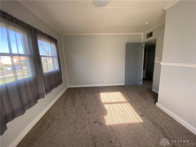 carpeted empty room featuring ornamental molding